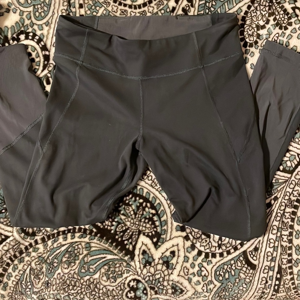 Under Armour tights with mesh calves. Size M